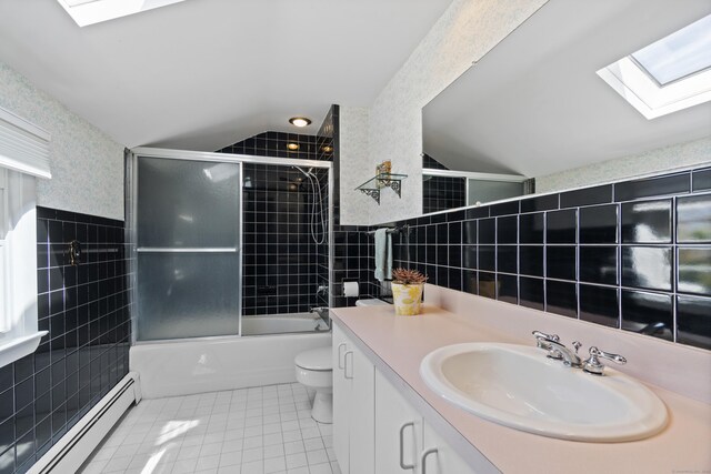 15 Maple Ln, Brookfield, CT 06804 - full bath featuring toilet, tile walls, baseboard heating, and tile patterned floors