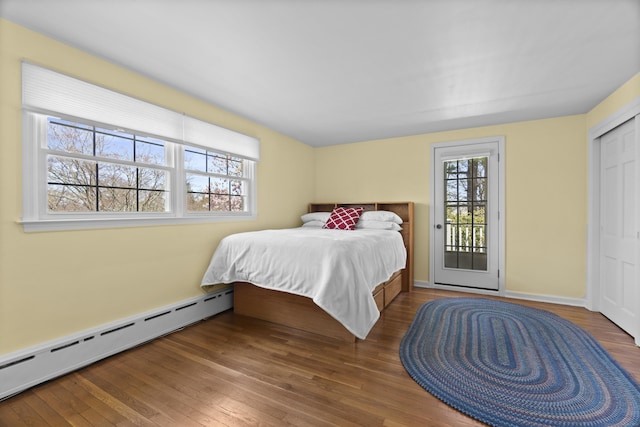15 Maple Ln, Brookfield, CT 06804 - bedroom featuring wood-type flooring, access to exterior, and a baseboard radiator