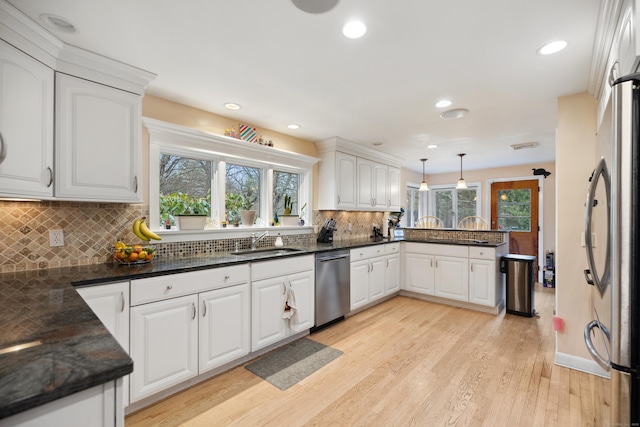 47 Notch Rd, Simsbury, CT 06092 - kitchen featuring appliances with stainless steel finishes, a sink, a peninsula, healthy amount of natural light, and recessed lighting