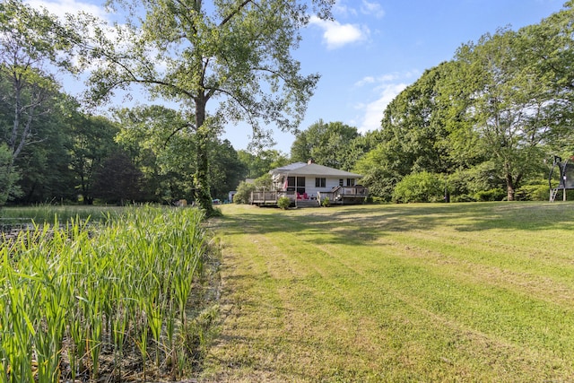 47 Notch Rd, Simsbury, CT 06092 - view of green lawn with a wooden deck and a forest view