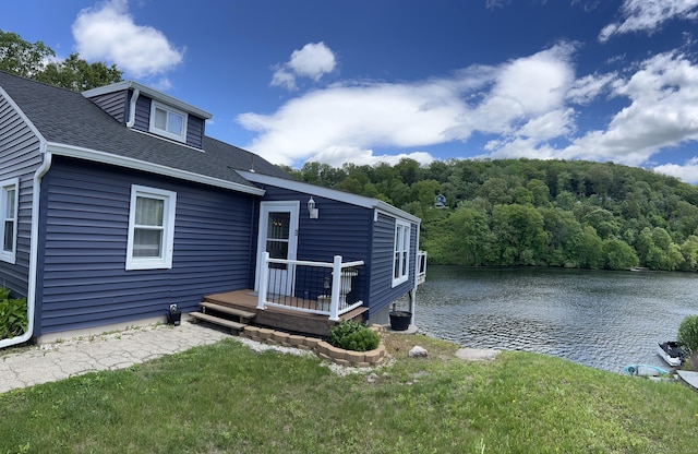 66 Waterview Dr, Newtown, CT 06482 - back of property with a yard, a shingled roof, a forest view, and a deck with water view