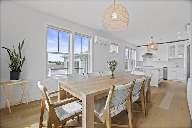 185 Main St Apt 301, East Lyme, CT 06357 - dining room with plenty of natural light, a wall mounted air conditioner, light wood-style flooring, and recessed lighting