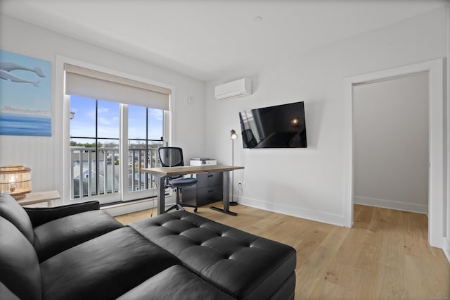 185 Main St Apt 301, East Lyme, CT 06357 - living area featuring baseboards, light wood-type flooring, and a wall mounted air conditioner