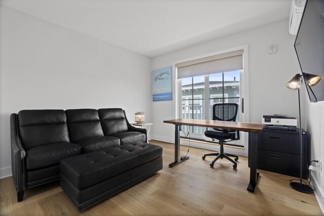 185 Main St Apt 301, East Lyme, CT 06357 - home office with baseboards, light wood-style flooring, and a baseboard radiator