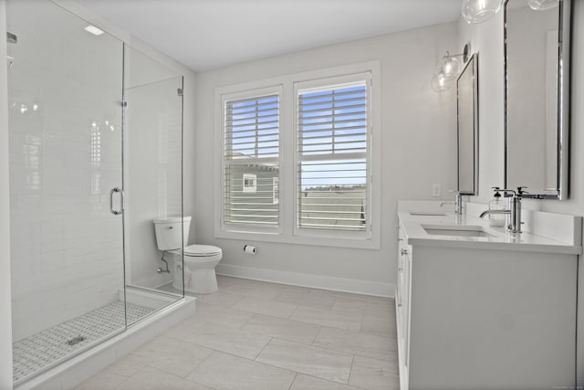 185 Main St Apt 301, East Lyme, CT 06357 - full bathroom with double vanity, toilet, baseboards, a sink, and a stall shower