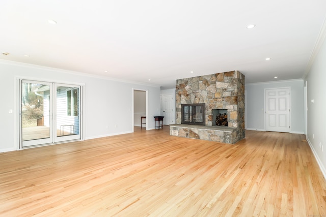 73A Long Meadow Hill Rd, Brookfield, CT 06804 - unfurnished living room with ornamental molding, light wood-style flooring, a stone fireplace, baseboards, and recessed lighting