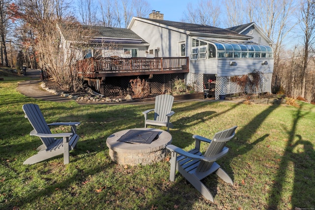 73A Long Meadow Hill Rd, Brookfield, CT 06804 - rear view of house featuring a wooden deck, a chimney, a sunroom, a yard, and an outdoor fire pit
