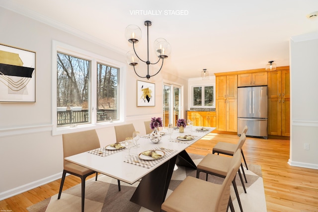 73A Long Meadow Hill Rd, Brookfield, CT 06804 - dining space with crown molding, baseboards, light wood-style floors, and a chandelier
