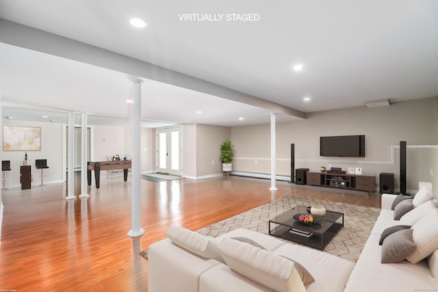 73A Long Meadow Hill Rd, Brookfield, CT 06804 - living area with baseboard heating, light wood finished floors, recessed lighting, baseboards, and ornate columns
