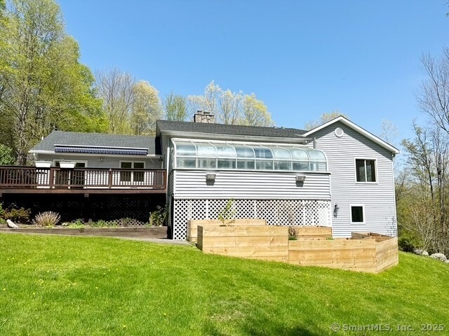 73A Long Meadow Hill Rd, Brookfield, CT 06804 - rear view of house with a deck, a lawn, and a chimney