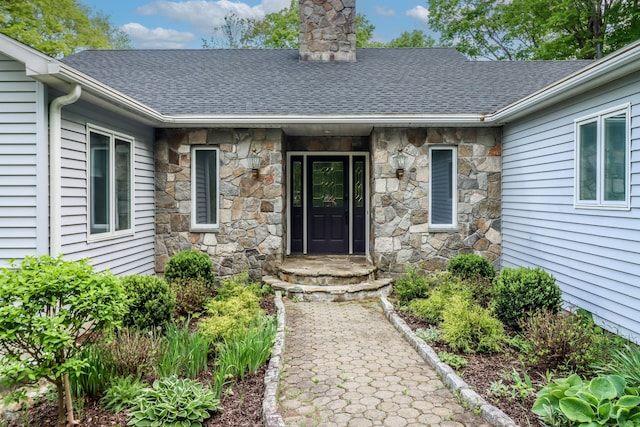 73A Long Meadow Hill Rd, Brookfield, CT 06804 - view of exterior entry featuring stone siding, a chimney, and roof with shingles