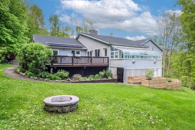 73A Long Meadow Hill Rd, Brookfield, CT 06804 - back of house featuring a chimney, a wooden deck, a sunroom, roof with shingles, and a yard