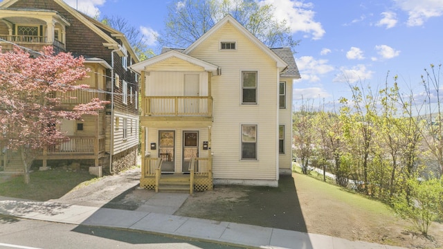 victorian-style house with a balcony
