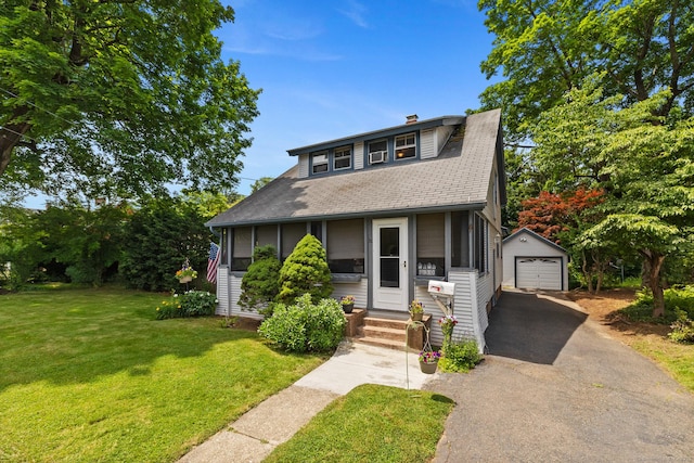 30 Phelps Rd, Manchester, CT 06042 - bungalow-style home featuring an outbuilding, asphalt driveway, a garage, a shingled roof, and a front yard
