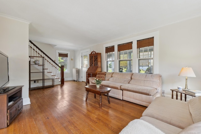 30 Phelps Rd, Manchester, CT 06042 - living room with radiator heating unit, stairs, and wood finished floors