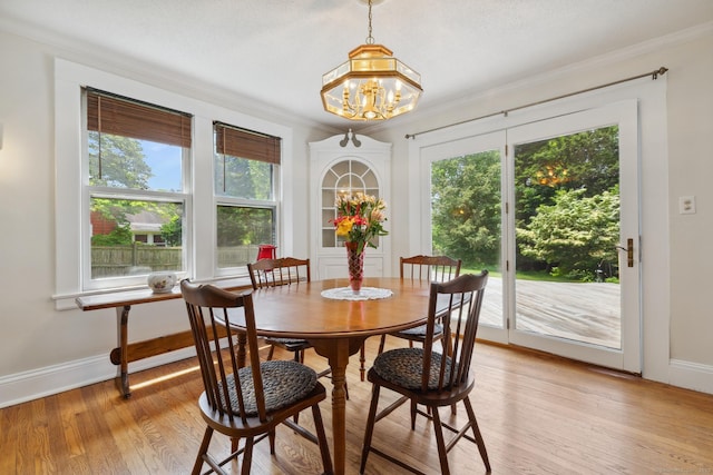 30 Phelps Rd, Manchester, CT 06042 - dining area featuring plenty of natural light, a chandelier, crown molding, and light wood-style floors