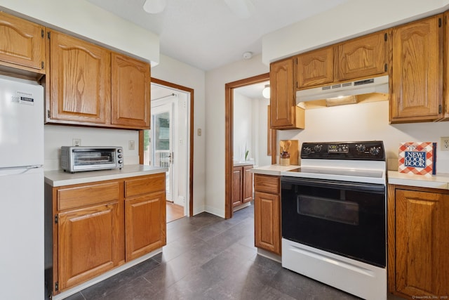 30 Phelps Rd, Manchester, CT 06042 - kitchen with freestanding refrigerator, electric stove, under cabinet range hood, light countertops, and brown cabinetry