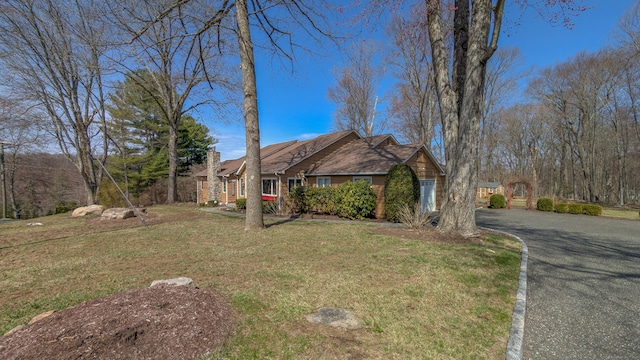 3 Mountain Dr, New Milford, CT 06776 - view of front of property with a chimney, driveway, and a front lawn