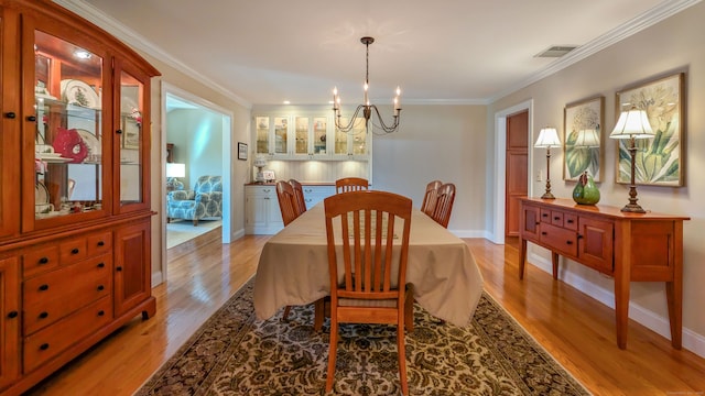 3 Mountain Dr, New Milford, CT 06776 - dining area featuring light wood-style floors, crown molding, visible vents, a notable chandelier, and baseboards