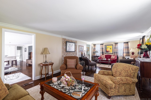 living room featuring crown molding, wood finished floors, and baseboards