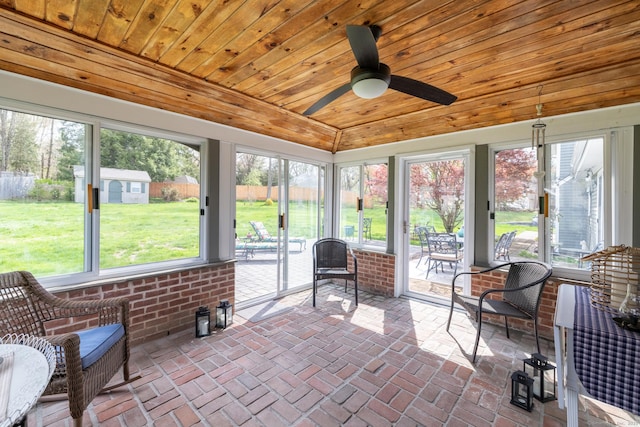 sunroom / solarium featuring ceiling fan and plenty of natural light