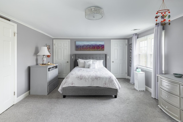 bedroom featuring baseboards, visible vents, ornamental molding, and light colored carpet
