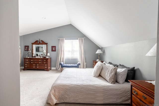 bedroom featuring vaulted ceiling, carpet floors, and baseboards