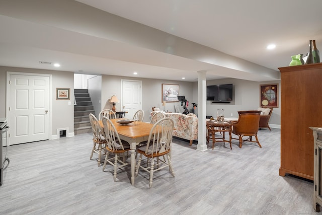 dining area featuring light wood-type flooring, baseboards, recessed lighting, and stairs