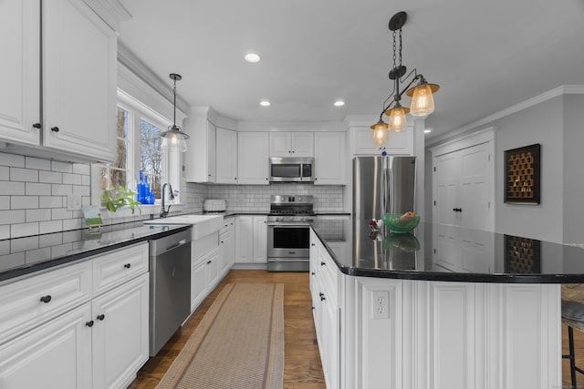 136 Tater Hill Rd, East Haddam, CT 06423 - kitchen featuring stainless steel appliances, white cabinetry, recessed lighting, tasteful backsplash, and ornamental molding