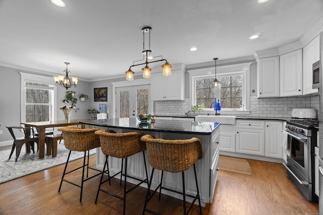 136 Tater Hill Rd, East Haddam, CT 06423 - kitchen featuring stainless steel appliances, a sink, healthy amount of natural light, dark countertops, and ornamental molding