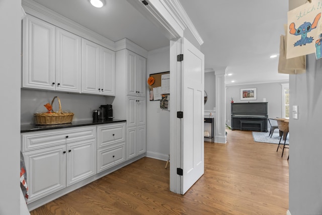 136 Tater Hill Rd, East Haddam, CT 06423 - hallway featuring decorative columns, light wood finished floors, ornamental molding, recessed lighting, and baseboards