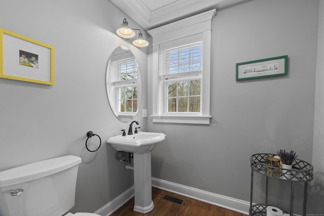 136 Tater Hill Rd, East Haddam, CT 06423 - half bathroom with toilet, baseboards, wood finished floors, and crown molding