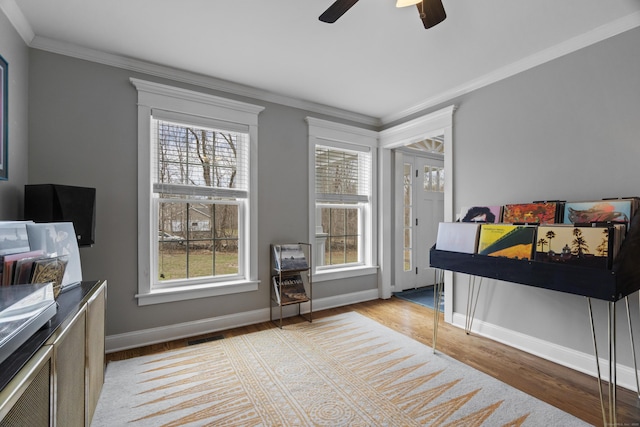 136 Tater Hill Rd, East Haddam, CT 06423 - bedroom with multiple windows, light wood-style floors, crown molding, baseboards, and a ceiling fan