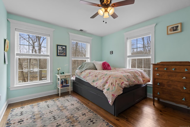 136 Tater Hill Rd, East Haddam, CT 06423 - bedroom with multiple windows, wood finished floors, baseboards, and ceiling fan