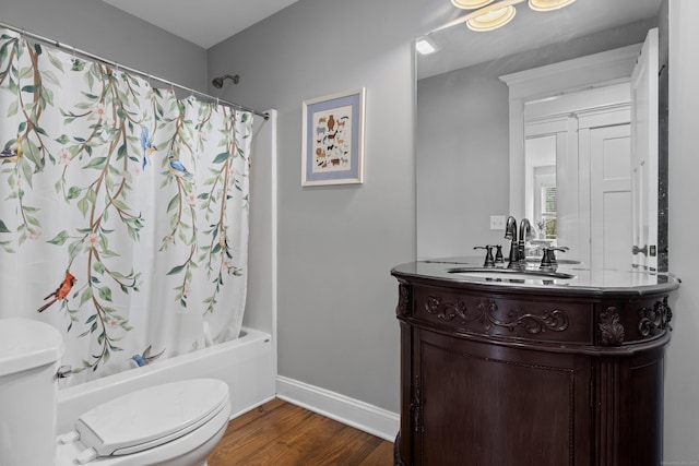 136 Tater Hill Rd, East Haddam, CT 06423 - bathroom featuring toilet, wood finished floors, vanity, shower / tub combo with curtain, and baseboards