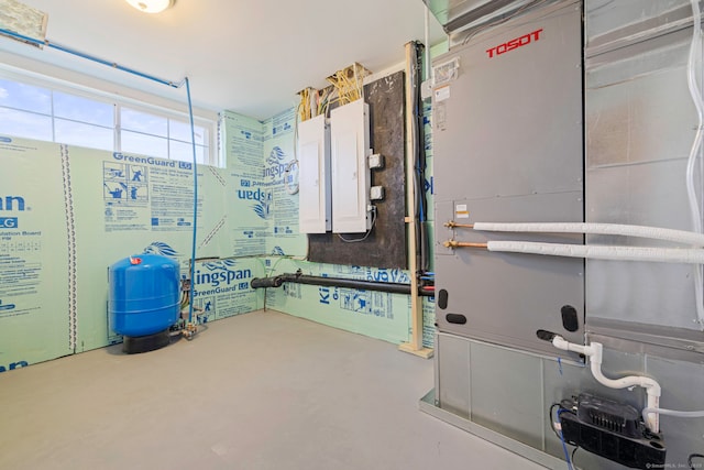 bathroom featuring heating unit and concrete flooring