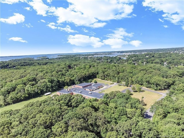 birds eye view of property with a wooded view
