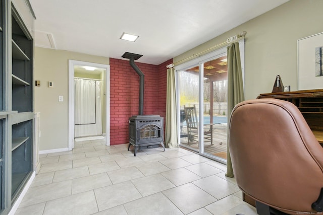 office with a wood stove and light tile patterned flooring