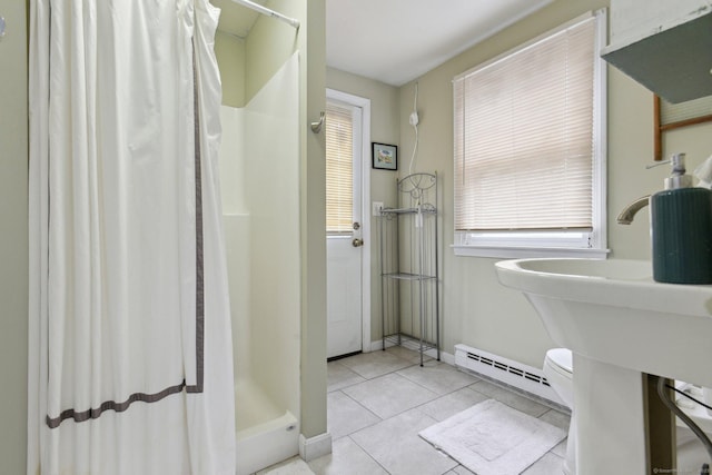 full bath featuring toilet, a baseboard heating unit, tile patterned floors, a shower stall, and baseboards