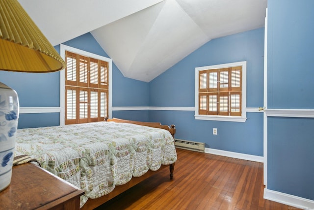 bedroom with baseboards, a baseboard radiator, wood-type flooring, and vaulted ceiling
