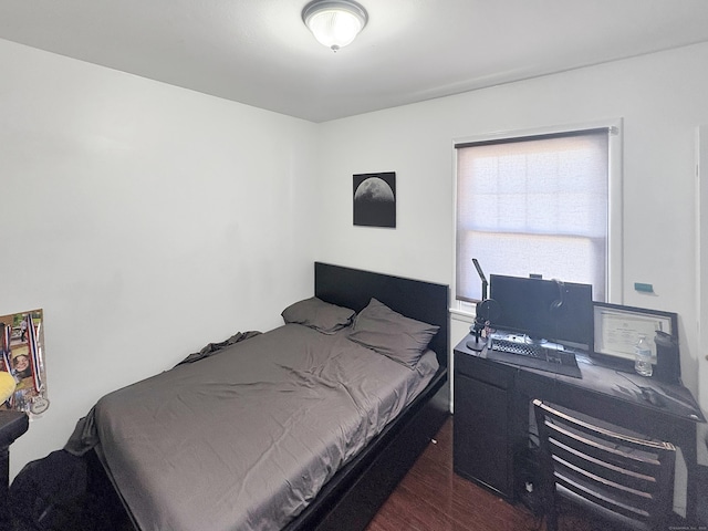 bedroom with wood finished floors