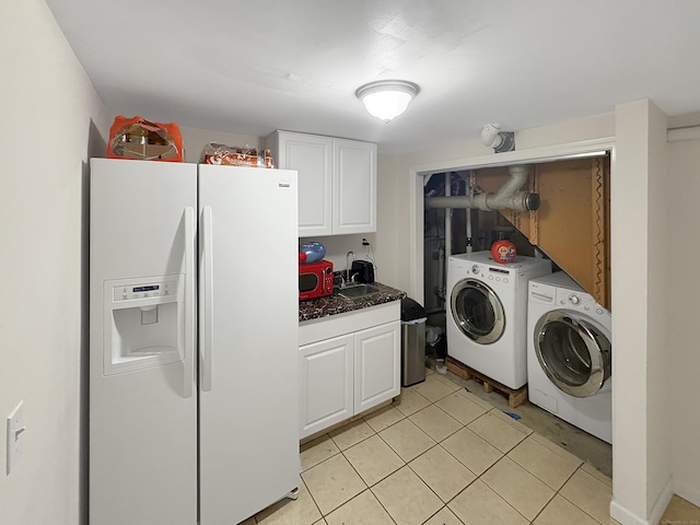 laundry area featuring a sink and washing machine and clothes dryer