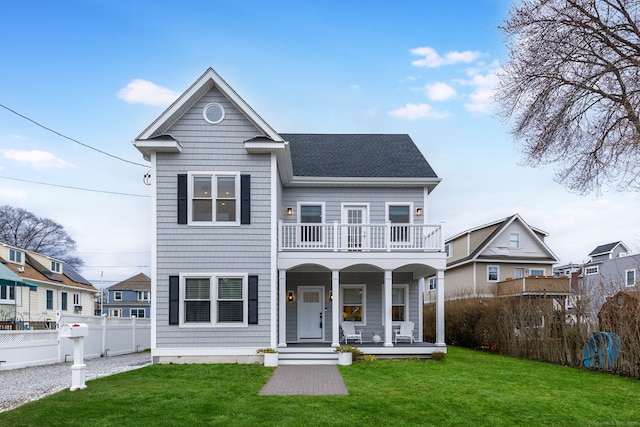 27 Hauser St, Milford, CT 06460 - view of front of house with a balcony, a front lawn, a porch, fence, and a shingled roof