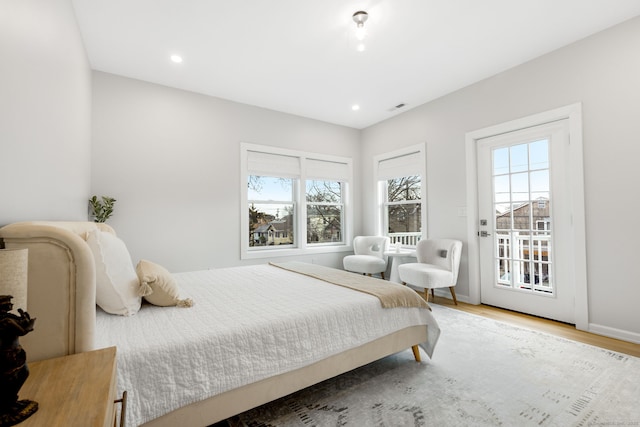27 Hauser St, Milford, CT 06460 - bedroom featuring access to outside, wood finished floors, multiple windows, and visible vents