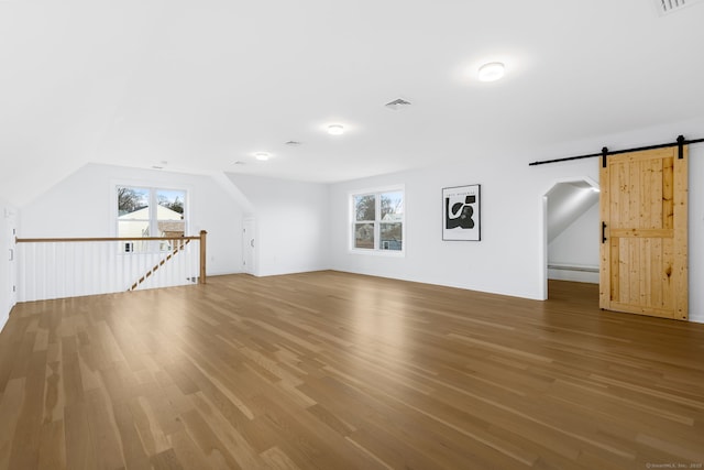 27 Hauser St, Milford, CT 06460 - bonus room featuring plenty of natural light, wood finished floors, visible vents, and a barn door