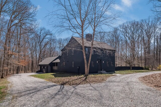 8 Shelter Rock Rd, East Haddam, CT 06423 - view of front of home with gravel driveway, a chimney, and roof with shingles