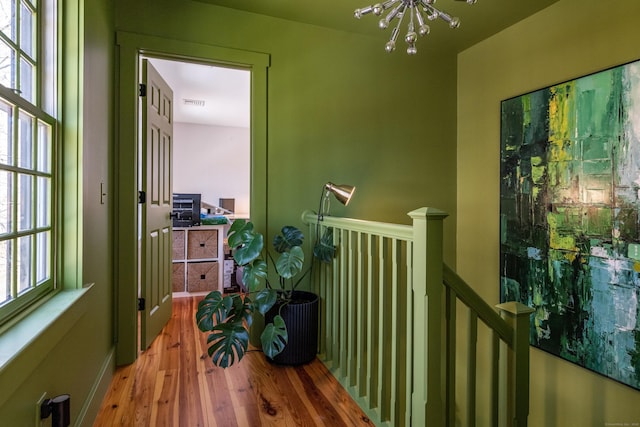 8 Shelter Rock Rd, East Haddam, CT 06423 - hallway with a chandelier, an upstairs landing, and wood finished floors