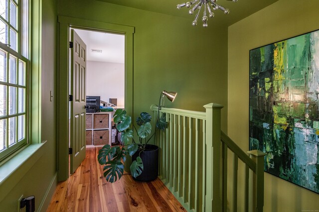 8 Shelter Rock Rd, East Haddam, CT 06423 - hallway with a chandelier, wood finished floors, and an upstairs landing