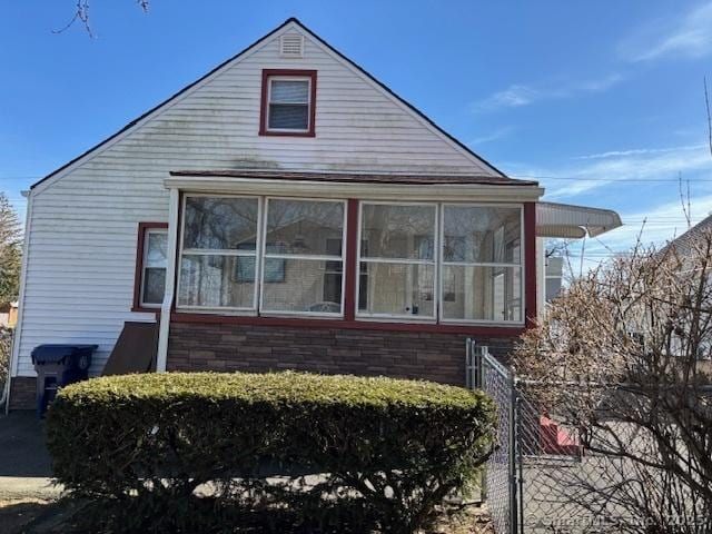 94 Morris St, West Haven, CT 06516 - view of side of property featuring fence and a sunroom