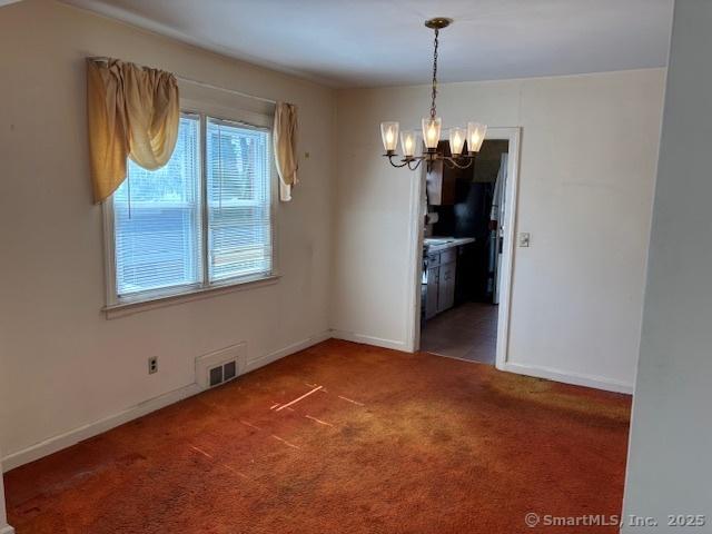 94 Morris St, West Haven, CT 06516 - unfurnished dining area with baseboards, visible vents, carpet floors, and a notable chandelier